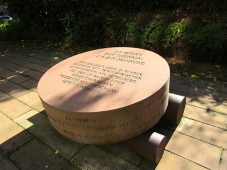 Photo from a round memorial stone with an inscription